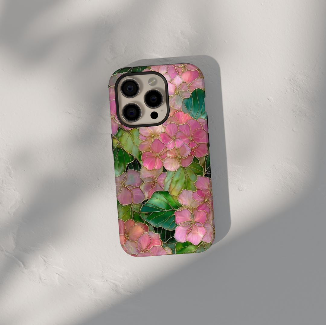 Pink floral iPhone 17 Pro Max case with gold outlined flowers and green leaves, aesthetic MagSafe tough case.