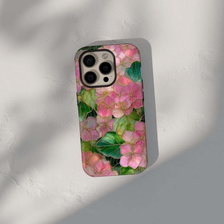 Pink floral iPhone 17 Pro Max case with gold outlined flowers and green leaves, aesthetic MagSafe tough case.