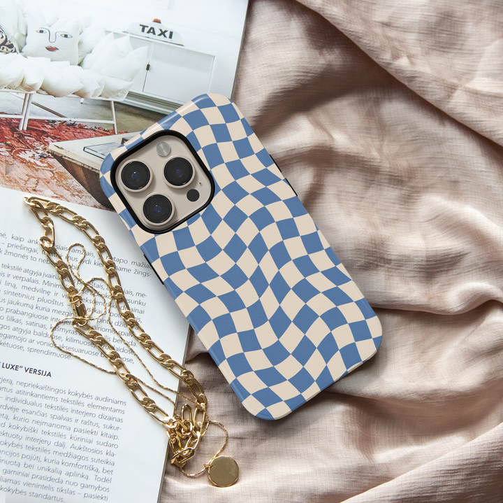 Making Waves blue checkerboard iPhone 18 Pro Max MagSafe case featuring a wavy blue and warm cream checkered pattern, a retro preppy protective tough iPhone 18 Pro phone case with an aesthetic distorted checkerboard design and MagSafe compatibility.