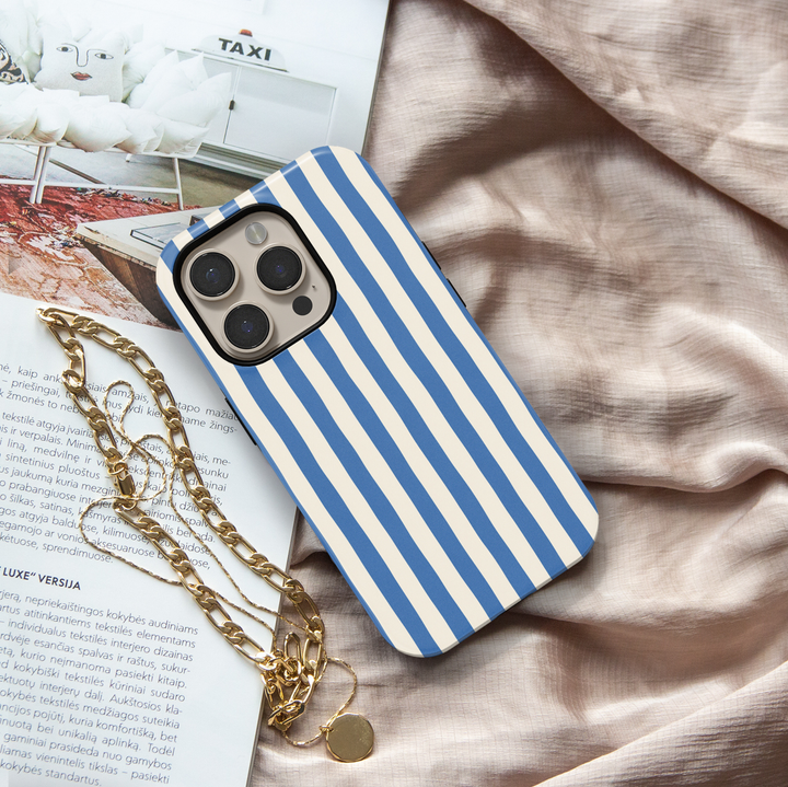 Poolside blue striped iPhone 18 Pro Max MagSafe case featuring bold cobalt blue and warm cream vertical stripes, a coastal preppy protective tough iPhone 18 Pro phone case with a classic striped design and MagSafe compatibility.