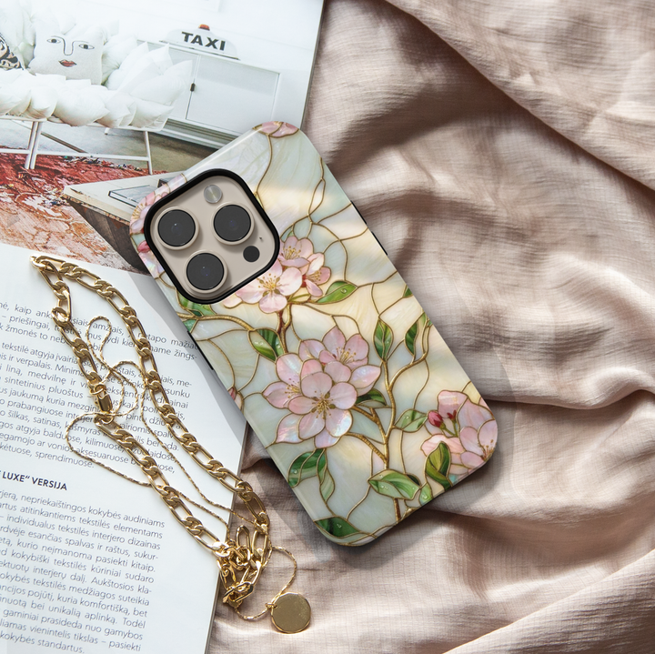 Soft pink blossom iPhone 17 Pro Max case with delicate floral design and stained-glass aesthetic finish.