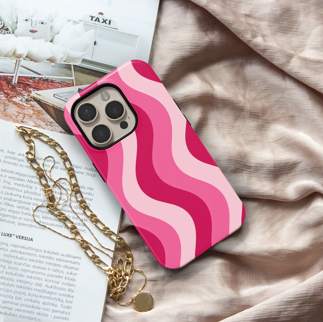 Pink Current hot pink iPhone 18 Pro Max MagSafe case featuring flowing wavy stripes in hot pink, bubblegum pink and soft blush, a cute feminine protective tough iPhone 18 Pro phone case with a retro aesthetic swirl pattern and MagSafe compatibility.