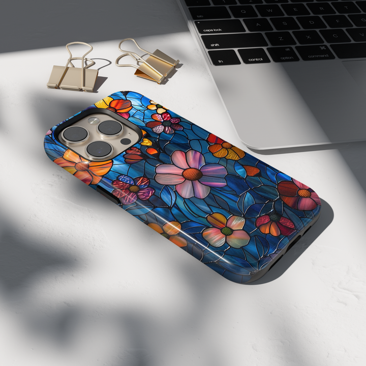 Colorful stained glass floral iPhone tough case with vibrant flowers and deep blue background