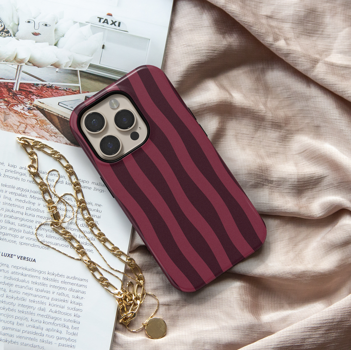 Velvet Rope burgundy striped iPhone 18 Pro Max MagSafe case featuring deep wine red, dark cherry and berry wavy vertical stripes, a sophisticated aesthetic protective tough iPhone 18 Pro phone case with a modern striped pattern and MagSafe compatibility.