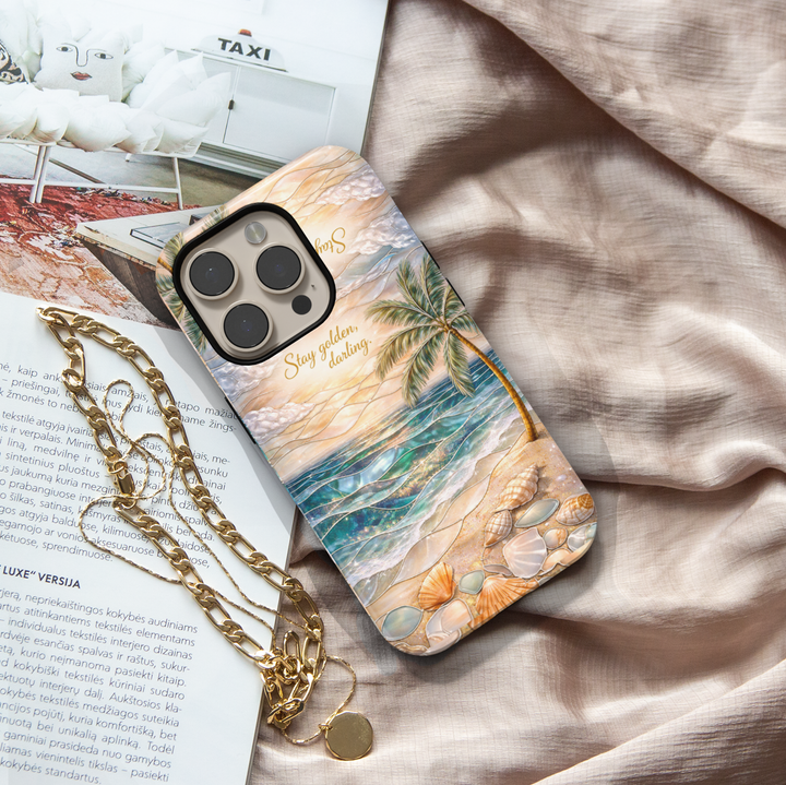 Beach aesthetic phone case featuring ocean sunset, palm tree, seashells and stay golden quote protective tough case for iPhone and Samsung Galaxy