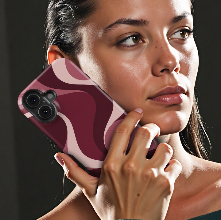 Slow Burn burgundy abstract iPhone 18 Pro Max MagSafe case featuring flowing merlot, wine red, dusty rose and blush pink waves, a feminine retro aesthetic protective tough iPhone 18 Pro phone case with a modern swirl design and MagSafe compatibility.