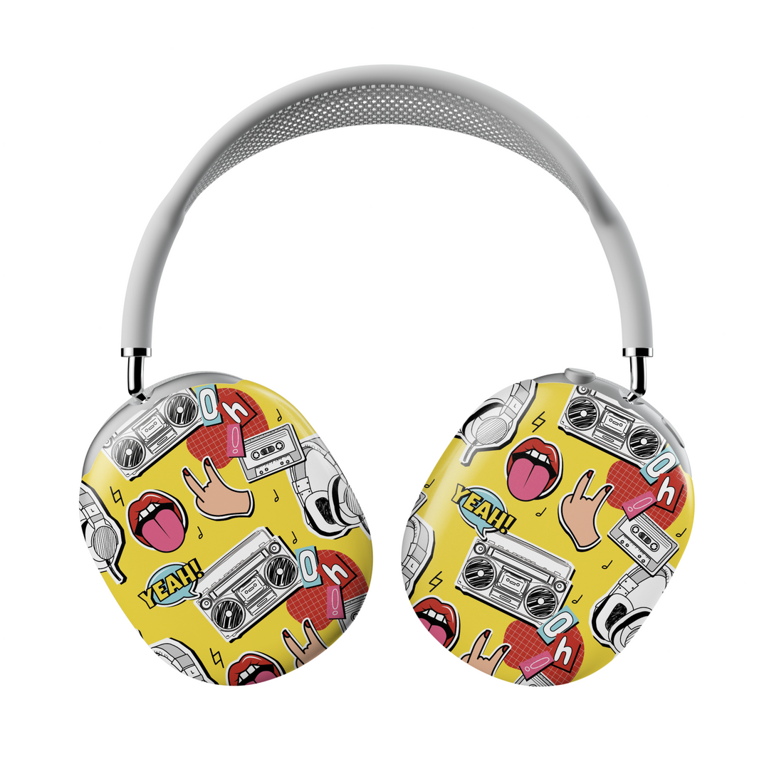 Yellow AirPods Max cover with pop art illustrations of boomboxes, headphones, rock hand signs, and comic-style text, bold retro headphone skin for Apple AirPods Max.