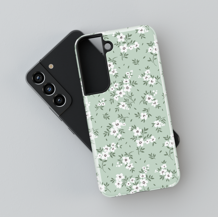 Galaxy phone case with sage green background and white floral pattern – minimalist and botanical design