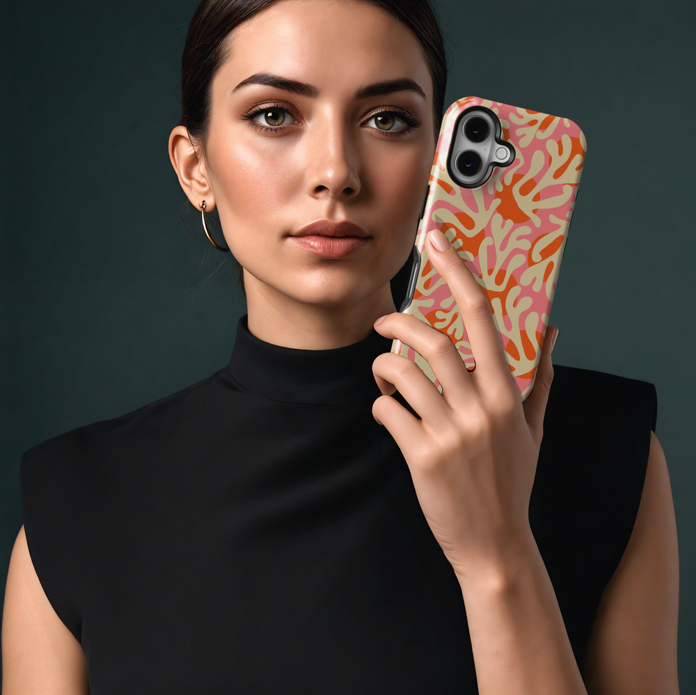 Bold coral pattern iPhone 16 MagSafe case in pink, orange, and cream tones with a beachy summer vibe