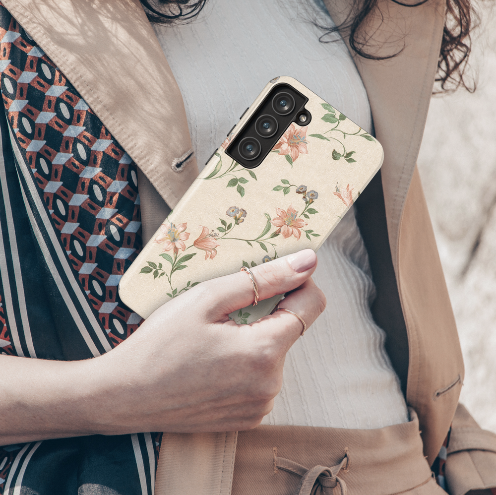 Beige vintage floral Samsung Galaxy case with peach lilies and blue wildflowers – romantic retro botanical phone cover