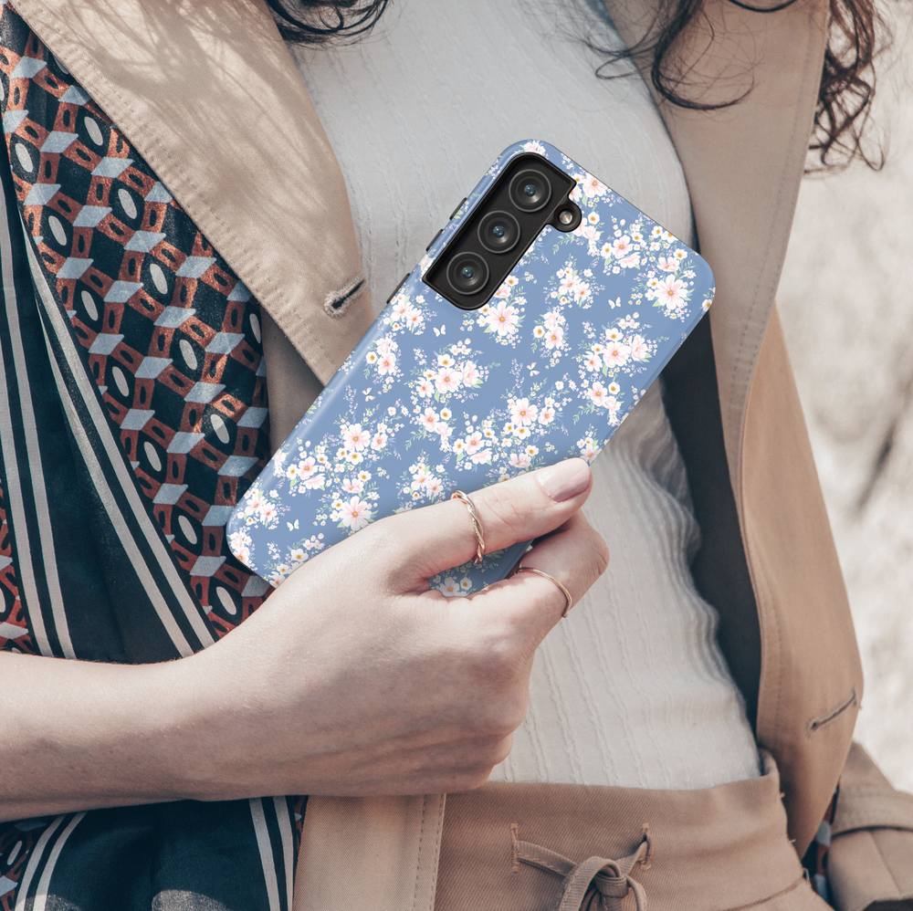 Dusty blue Samsung Galaxy phone case with light pink floral clusters – elegant feminine cover for spring vibes
