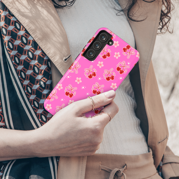 Coquette pink Samsung Galaxy case with red cherries, heart bows, and floral accents – cute girly aesthetic protective phone cover