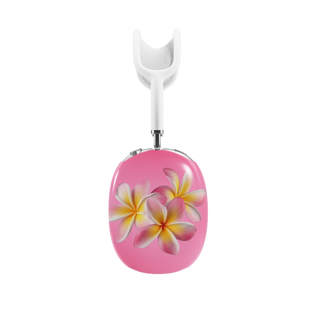 Pink AirPods Max cover with tropical plumeria flower design, vibrant floral headphone skin for Apple AirPods Max, island-inspired aesthetic tech accessory.