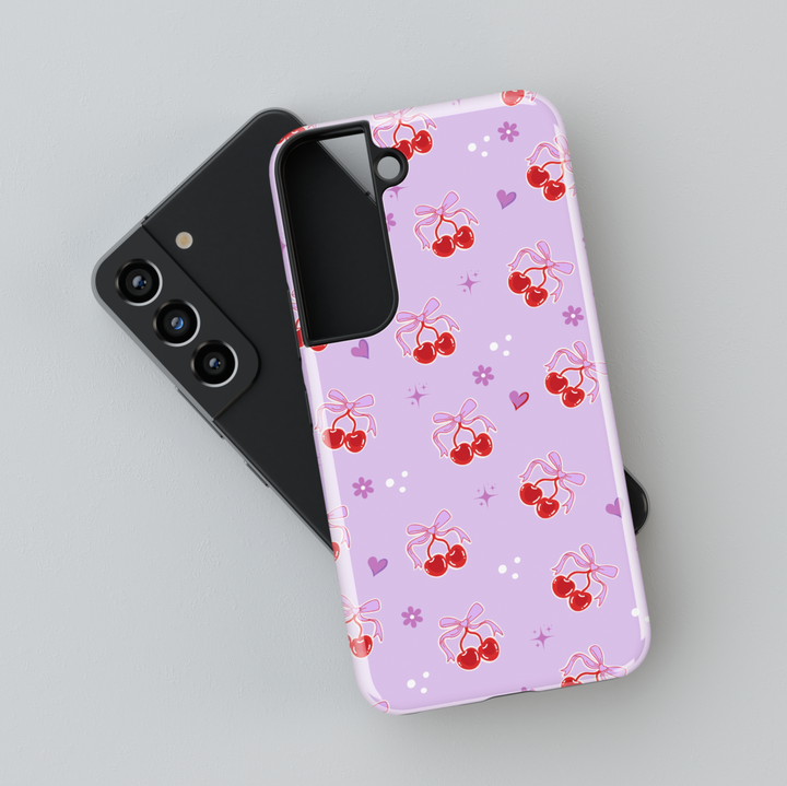 Coquette Purple Samsung Galaxy case with red cherries, heart bows, and floral accents – cute girly aesthetic protective phone cover
