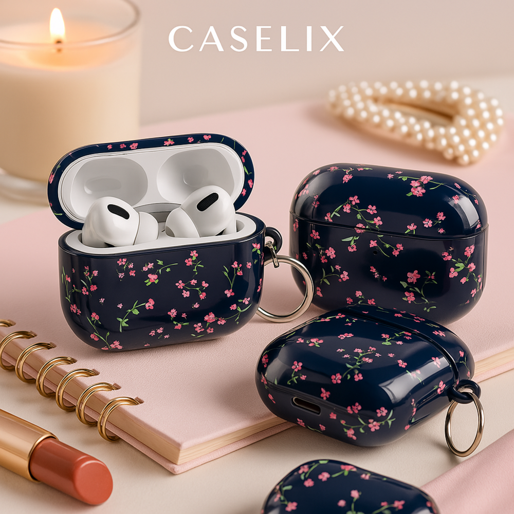 Navy blue AirPods case with pink floral design and silver keyring, cute botanical protective cover for AirPods Pro or AirPods 3.