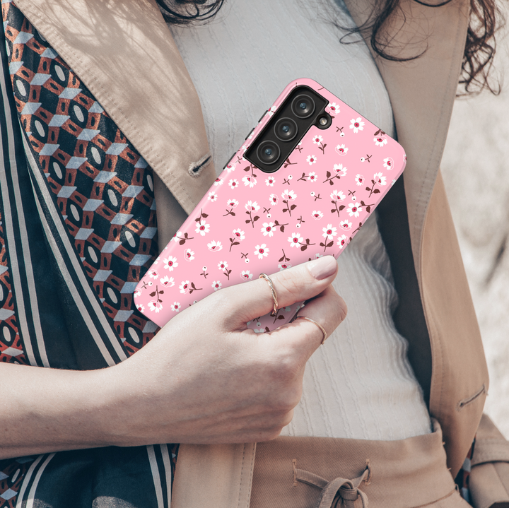 Pink floral Galaxy phone case with small white flowers and red accents – cute girly phone case