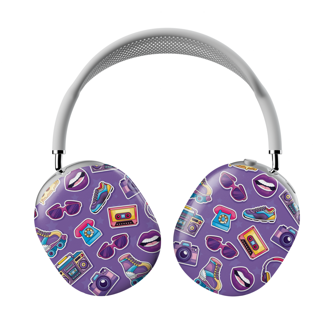 Purple AirPods Max cover with colorful retro stickers including cassettes, cameras, lips, sneakers, and phones, Y2K aesthetic headphone skin for Apple AirPods Max.