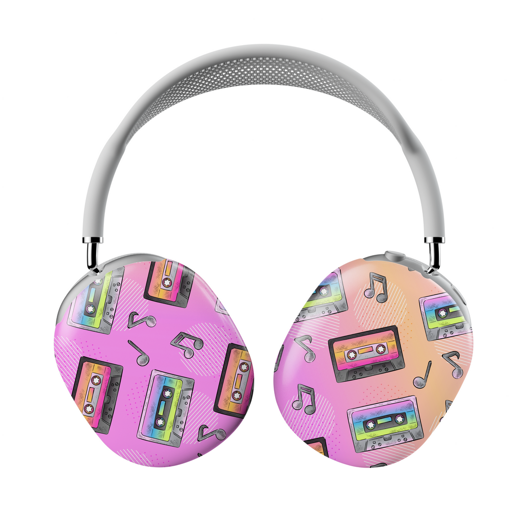 Colorful AirPods Max cover with rainbow cassette tapes and music note icons on pink and peach gradient background, retro aesthetic headphone skin for Apple AirPods Max.