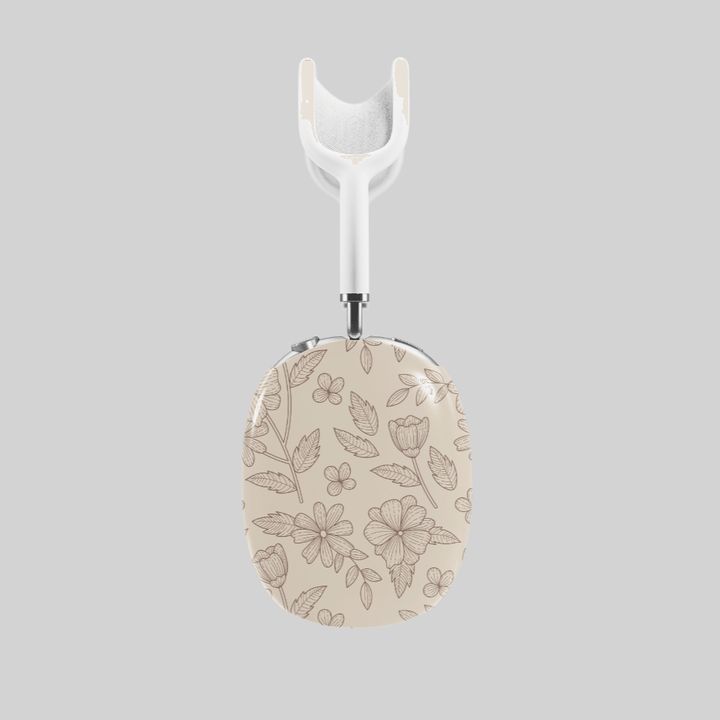Beige AirPods Max cover with delicate brown floral line art, minimalist botanical headphone skin for Apple AirPods Max, elegant neutral tech accessory.