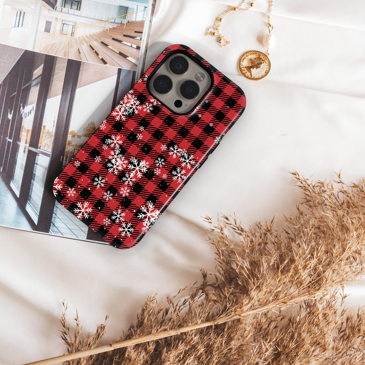 Red and black buffalo plaid iPhone case with white snowflakes holiday winter pattern