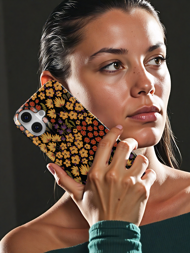 Autumn floral phone case with yellow, orange, and purple flowers on black background, fall aesthetic design